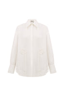 Relaxed-fit ivory blouse by Malva Florea, casual shirt with soft fabric and stylish design, shown on a model.