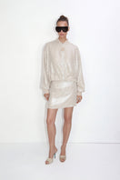 Beige sequin blazer by Malva Florea, stylish tailored blazer with shimmering sequins, front buttons, and classic fit.