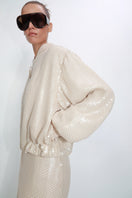 Beige sequined blazer by Malva Florea, stylish tailored blazer with shimmering sequins, perfect for elegant occasions.