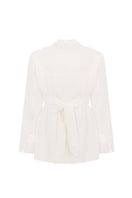 Elegant ivory tailored blazer by Malva Florea with a structured fit and classic lapel, shown on a neutral background.