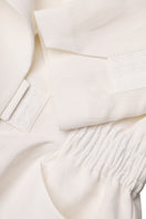 Malva Florea tailored ivory blazer with structured fit, featuring classic lapels and sleek design, perfect for professional or stylish wear.