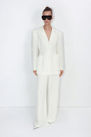 Malva Florea classic tailored ivory pants displayed on a model, showcasing their fit and elegant design.