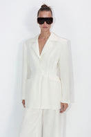 Malva Florea tailored ivory blazer with a sleek fit, featuring classic lapels and structured design, perfect for professional or formal wear.