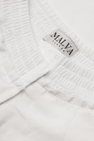 Malva Florea classic tailored ivory pants, shown with a smooth fit and clean design, perfect for professional or casual wear.