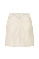 Beige mini skirt with shiny sequin embellishments from Malva Florea, styled with a fitted waist and flared hem.