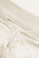 Beige mini skirt with sequins from Malva Florea, featuring a stylish, fitted design and shiny sequin details.