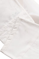 Ivory bandeau crop top by Malva Florea, featuring a fitted style and minimalist design, shown on a model.