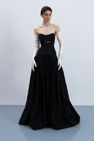 Black Maxi Gown by Monetre, elegant floor-length gown with flowing fabric and sophisticated silhouette.