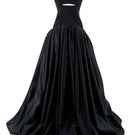 Black Monetre gown maxi dress with figure-flattering silhouette, elegant design, and flowing fabric.