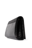 Black glitter Terry de Havilland Mia clutch bag with a sleek, compact design and stylish metallic finish.