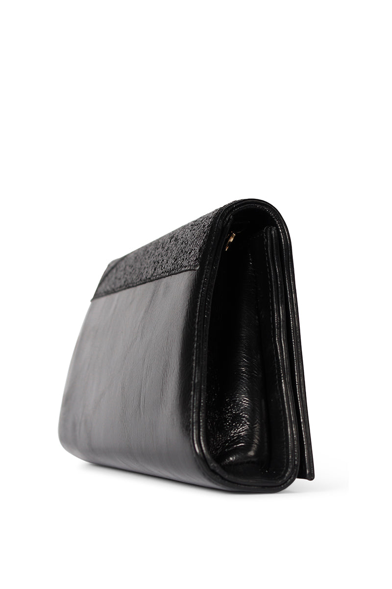 Black glitter Terry de Havilland Mia clutch bag with a sleek, compact design and stylish metallic finish.