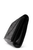 Black glitter clutch bag by Terry de Havilland, featuring a sleek, compact design with a stylish, shimmering finish.