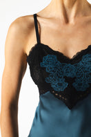 Navy blue silk MIREILLE baby doll chemise nightgown with delicate starry pattern, from NK IMODE, displayed on a flat surface.