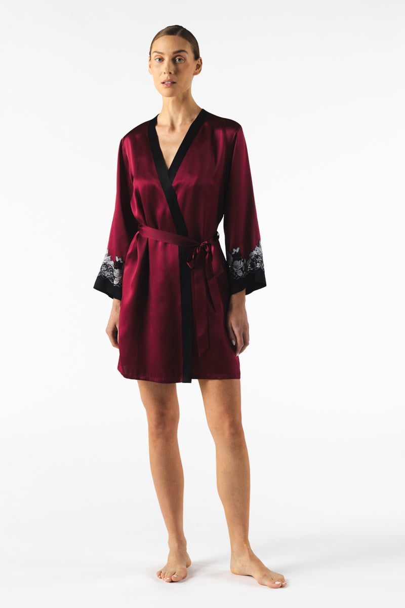 NK IMODE ROXY short silk robe in Bordeaux, featuring a smooth satin finish and elegant design, displayed on a hanger.