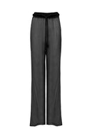 Black TATACOA pants by LAURA ESCOBAR featuring a tailored fit and sleek design, shown on a model.
