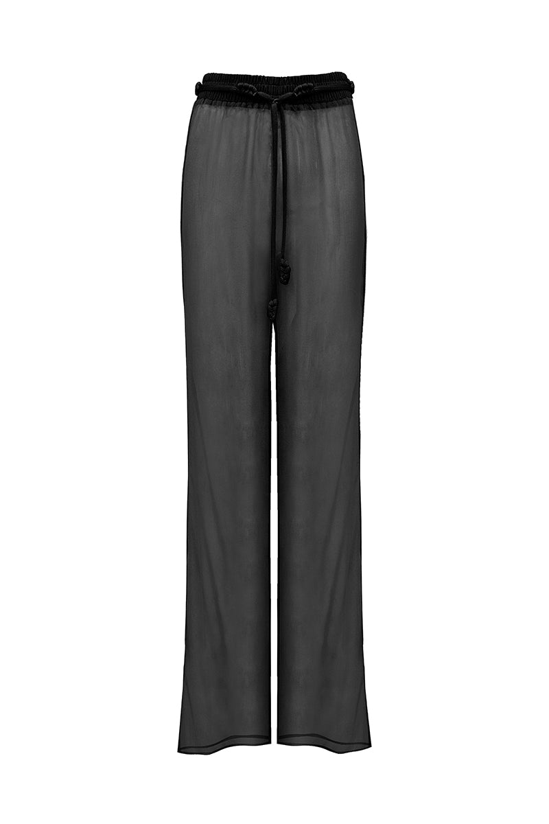 Black TATACOA pants by LAURA ESCOBAR featuring a tailored fit and sleek design, shown on a model.
