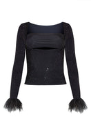 LEDIEL Pluma Top, stylish women's blouse with ruffled details and lightweight fabric, displayed on a hanger.