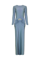 Blue DUNA PLATINUM maxi dress by LAURA ESCOBAR with flowing fabric and elegant design, shown on a model.