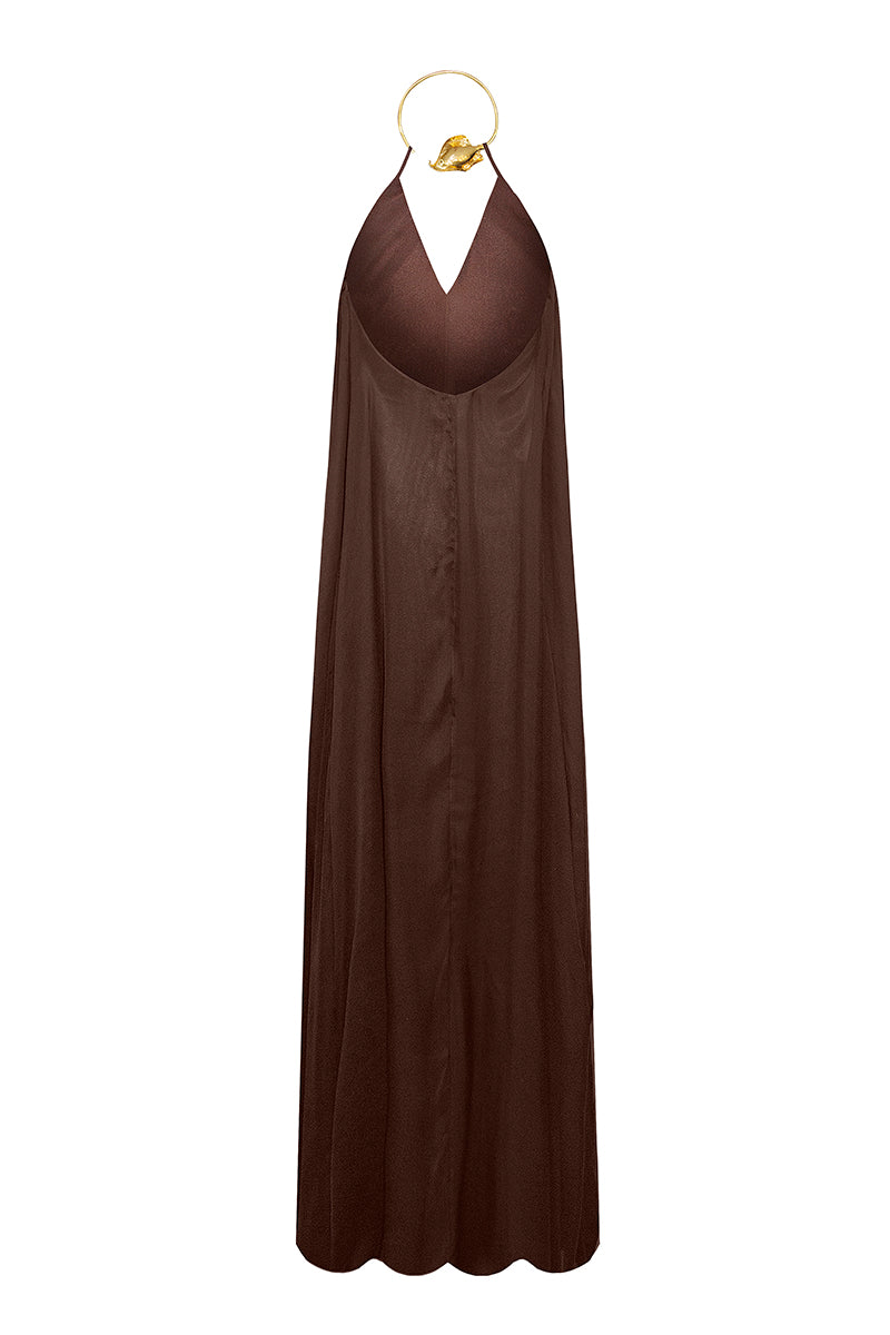 Brown Portobello maxi dress by Laura Escobar displayed on a model, showcasing its flowing fabric and elegant design.