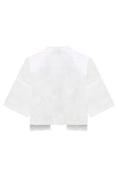 White Lina shirt by Laura Escobar, featuring a classic collar and tailored fit, displayed on a hanger.