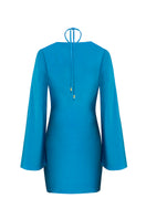 Teal Andrea maxi dress by Laura Escobar displayed on a hanger, showcasing its flowing fabric and elegant design.