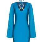 Laura Escobar Andrea teal maxi dress hanging on a wooden hanger, showcasing its flowing fabric and elegant design.