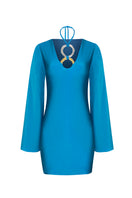 Laura Escobar Andrea teal maxi dress hanging on a wooden hanger, showcasing its flowing fabric and elegant design.