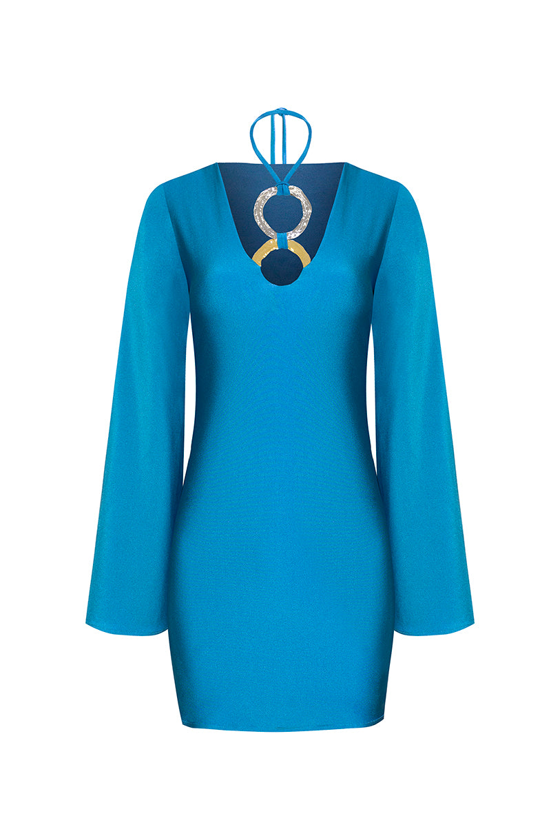 Laura Escobar Andrea teal maxi dress hanging on a wooden hanger, showcasing its flowing fabric and elegant design.