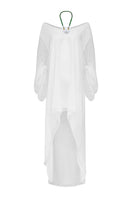 White PAZ maxi dress by LAURA ESCOBAR featuring flowing fabric and elegant design, perfect for summer or casual occasions.