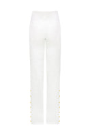 Laura Escobar Lina Pants in white, stylish women’s pants with a tailored fit, shown in a clean, casual outfit.