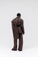 Studio NK Midnight pants in ash brown, showcasing relaxed fit, soft fabric, and stylish design in a natural stance.