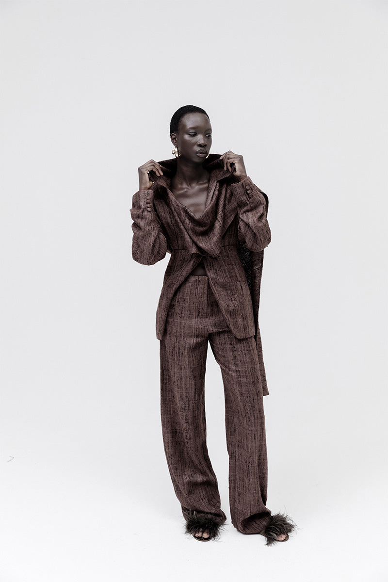 Studio NK Midnight Pants in Ash Brown, stylish casual pants with a relaxed fit and soft fabric, shown on a model.