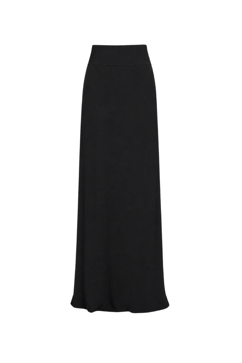 Black Tinta Latina Miel maxi skirt with flowing fabric and waist tie, styled as a versatile women's fashion piece.