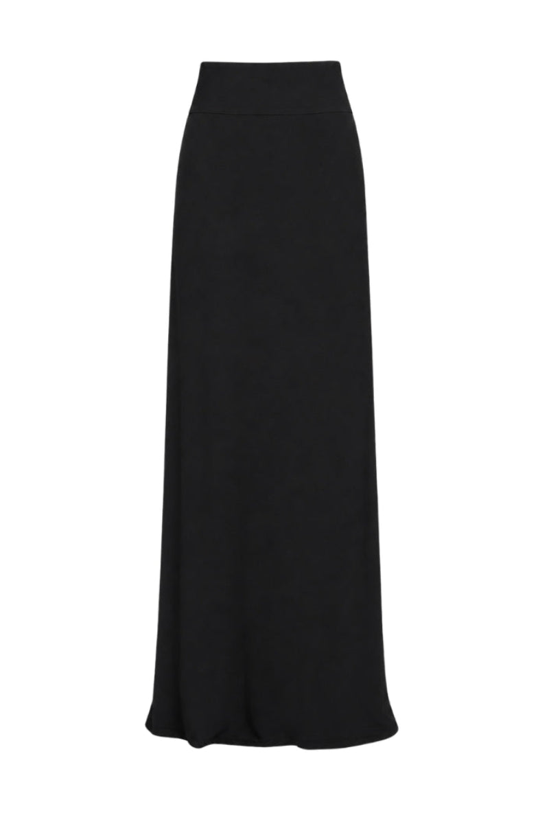 Black Tinta Latina Miel maxi skirt with flowing fabric and waist tie, styled as a versatile women's fashion piece.