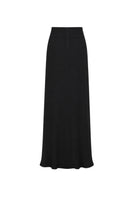 Black Tinta Latina Miel Maxi Skirt displayed on a model, showcasing its flowy fabric and elegant design.