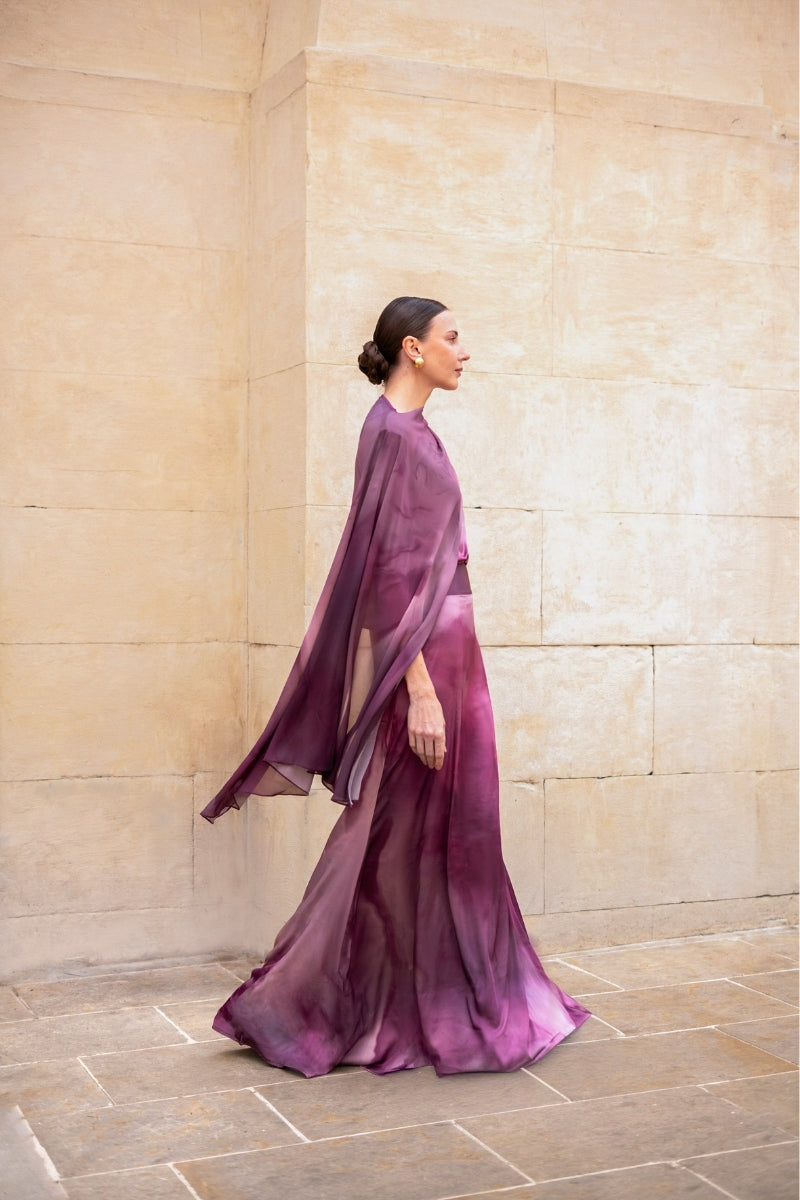 Purple printed Miel maxi skirt by Tinta Latina, flowing fabric with vibrant floral pattern, full-length view.