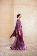 Purple printed Miel maxi skirt by Tinta Latina, flowing fabric with vibrant floral pattern, full-length view.