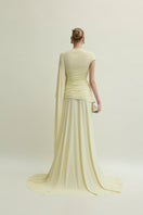 Yellow Minerva gown by Jenny K Tran displayed on a model, showcasing elegant fabric and stylish design.