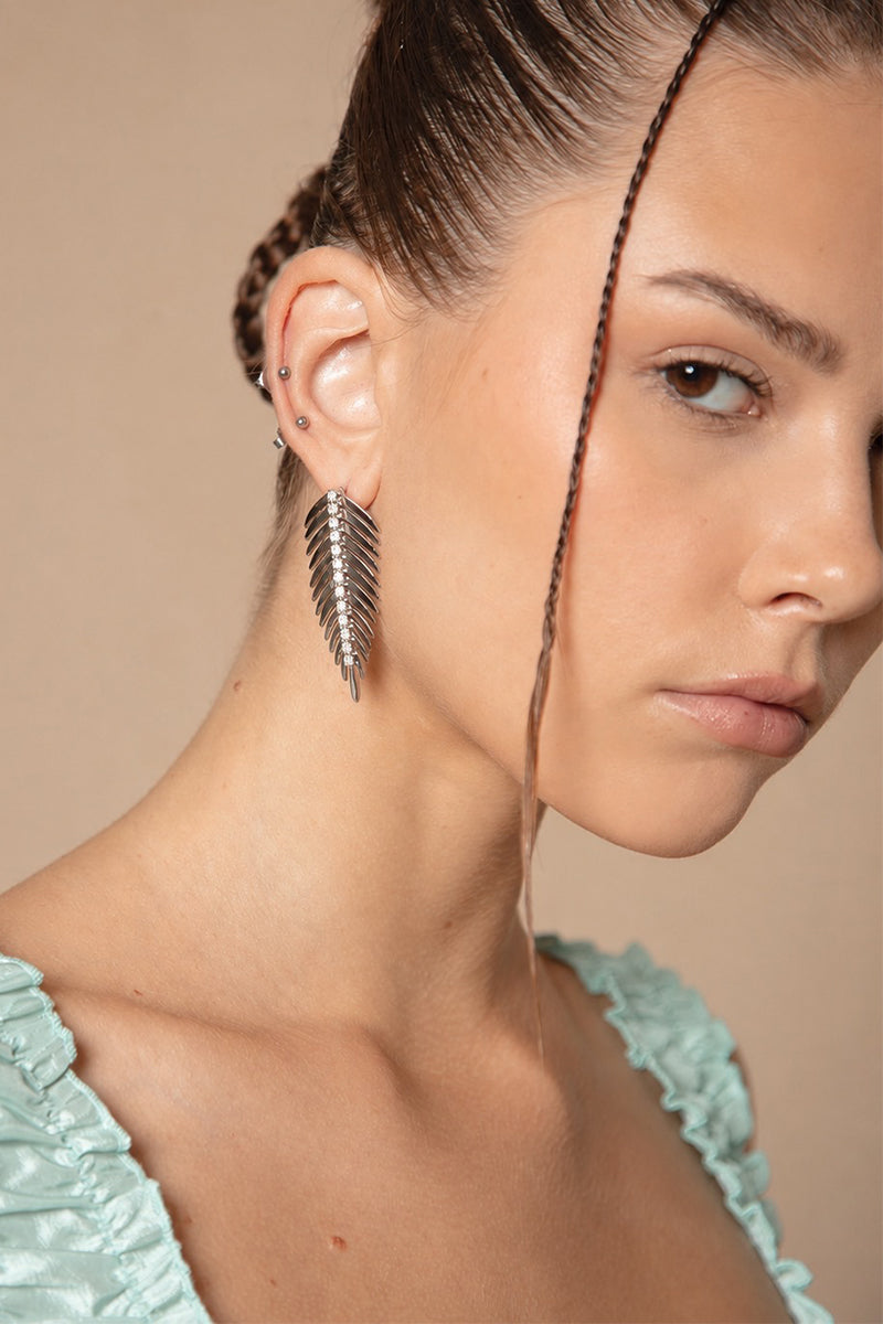 Silver and white miniature earrings by Jessica K featuring delicate, elegant design suitable for everyday wear.