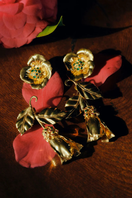 Mini Boboli earrings in vibrant emerald green by Peracas, featuring a delicate hoop design with a polished finish.