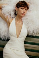 Elegant MIRA dress by Gigii's, showcasing a flowing gown with intricate details and stylish design for formal occasions.