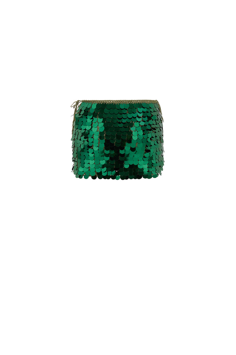 Emerald green mini skirt by Mirel Prentice with hand-crochet sequins, showcasing intricate embellishments and a fitted silhouette.