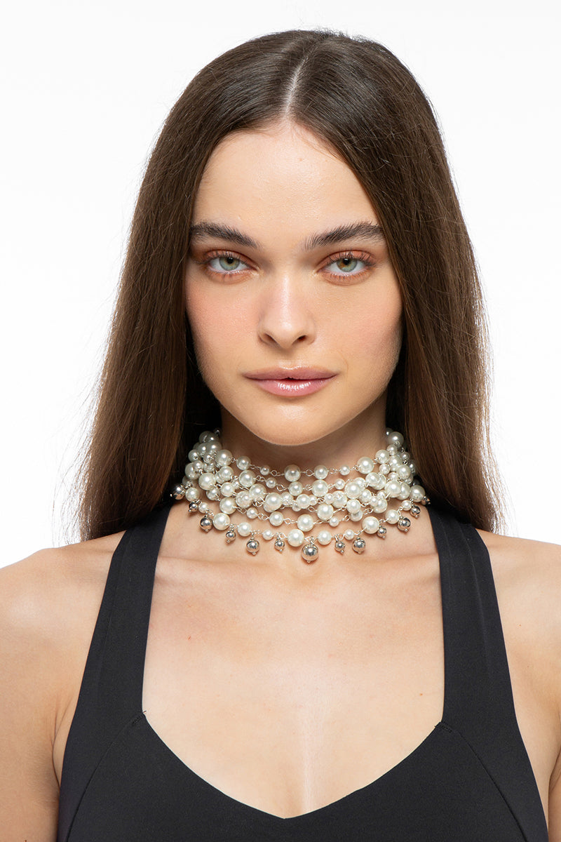 Silver and pearl necklace by Silvia Gnecchi featuring elegant, handcrafted design with delicate pearls and silver accents.