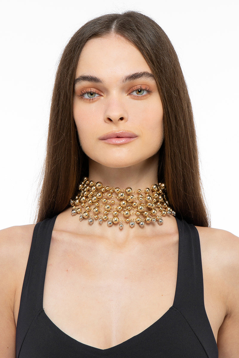 Gold and silver MIRU necklace by Silvia Gnecchi, featuring a stylish, minimalist design with delicate chain links.