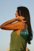 Mesh Alhambra top handle bag in gradient Bahari blue, featuring a stylish design and smooth leather texture.