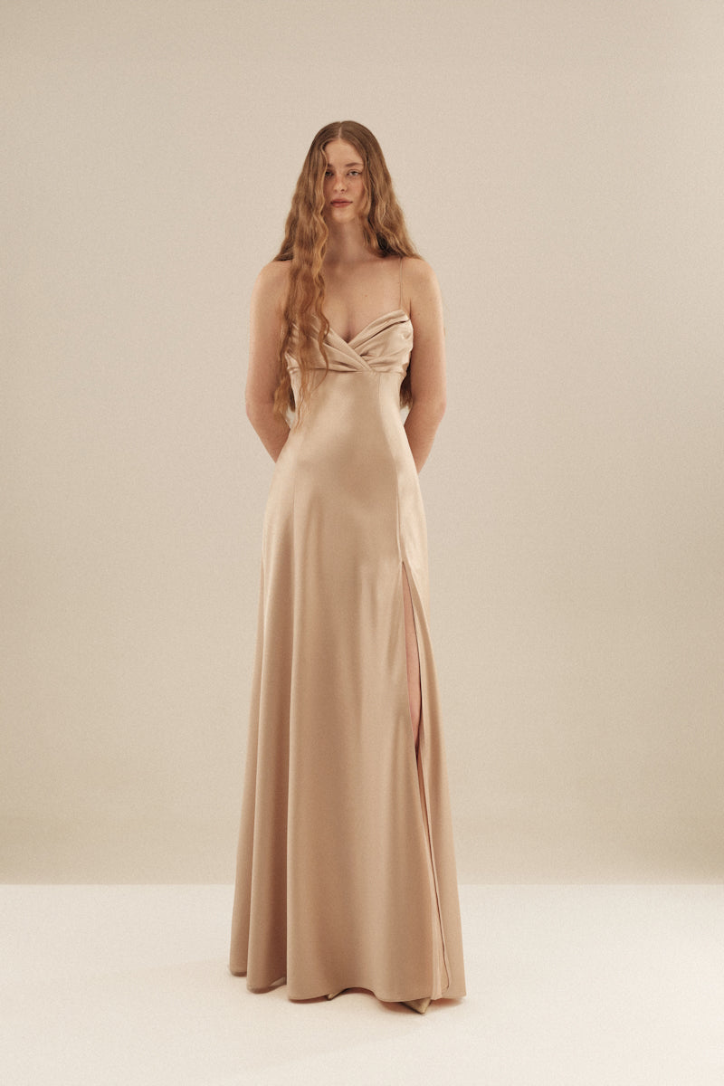 Elegant Cult Mia X Monetre Lueur gown by Monetre, featuring flowing fabric and intricate design details.