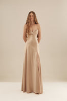 Elegant CULT MIA X Monetre luminous gown displayed in soft fabric with intricate design and flowing silhouette.