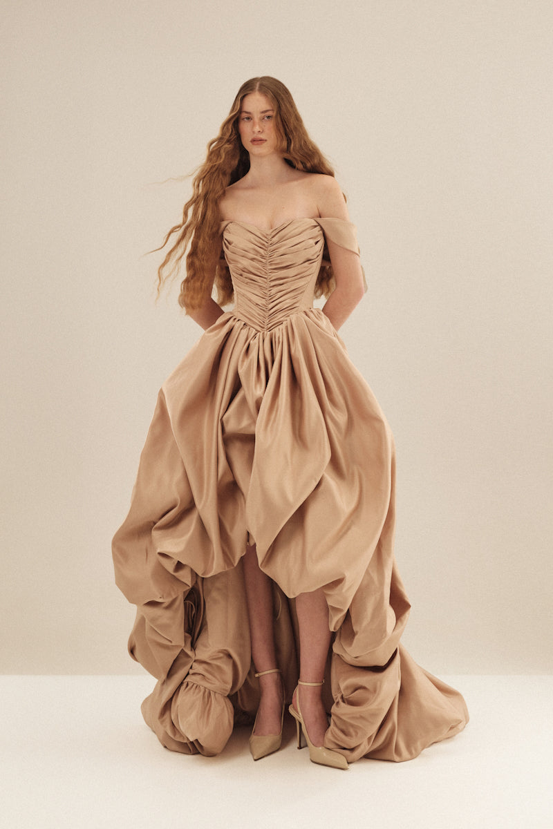 Elegant CULT MIA X MONETRE Aura gown featuring flowing fabric and intricate detailing, perfect for formal occasions.