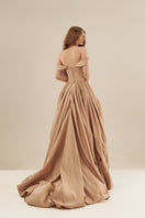 Monetre CULT MIA X Monetere Aura gown in elegant fabric with intricate detailing, showcased on a model.