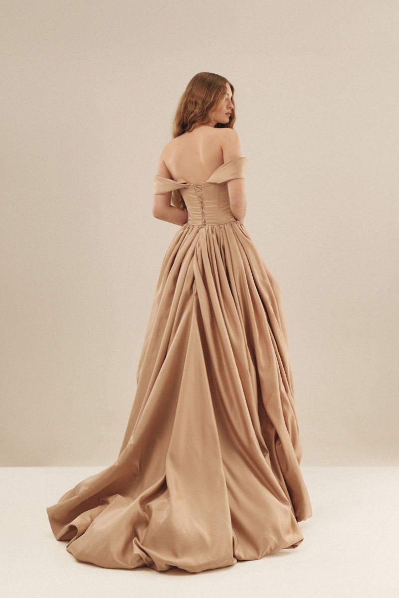 Monetre CULT MIA X Monetere Aura gown in elegant fabric with intricate detailing, showcased on a model.